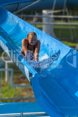 Pretty girl enjoy the water-park in summer
