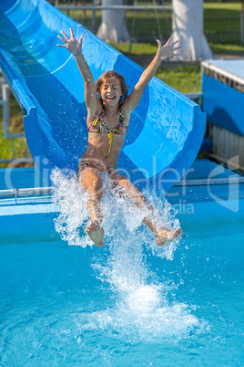 Pretty girl enjoy the water-park in summer