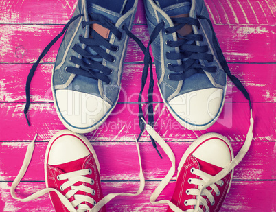 Two pairs of textile sneakers with loose laces