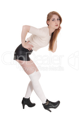 Woman standing bend hand on hip and face