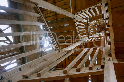 stairwell view from below, the wooden stairs to the observation