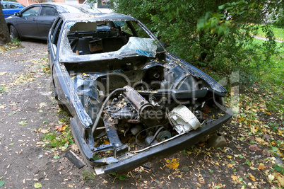 old abandoned car, an old broken-down rusty