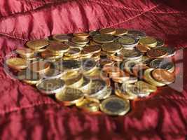 Euro coins, European Union over red velvet background