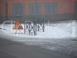 road works sign in the snow