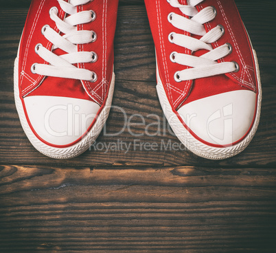 pair of red textile sneakers