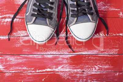 pair of old blue worn textile shoes