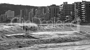 Beautiful sunset in Spain with big waves in black and white colo