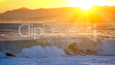 Beautiful sunset in Spain with big waves, Costa Brava