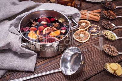 mulled wine in a pot with handles and ingredients
