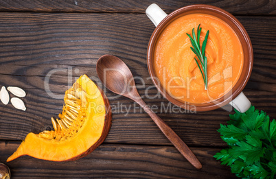 fresh pumpkin soup in a ceramic plate