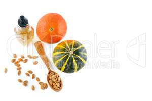 Fresh pumpkin oil isolated on white background. Flat lay, top vi