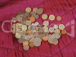 Pound coins, United Kingdom over red velvet background