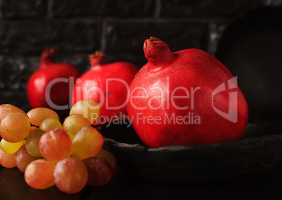 Still life with a pomegranate. Autumn fruits.