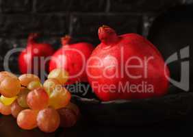 Still life with a pomegranate. Autumn fruits.