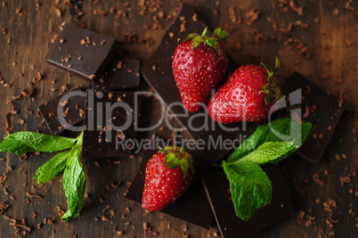 Still life with strawberries and chocolate bars