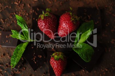 Still life with strawberries and chocolate bars