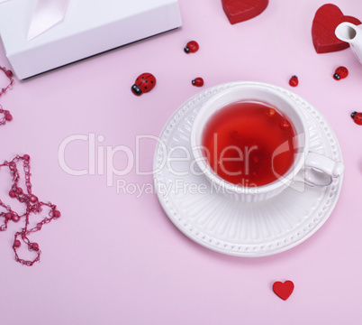 tea from berries of a viburnum in a white ceramic mug
