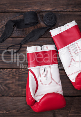 pair of boxing gloves and black bandage