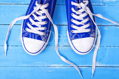 pair of blue textile shoes