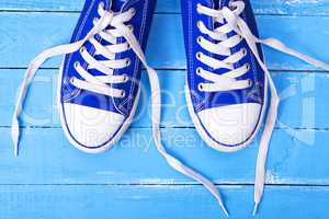 pair of blue textile shoes