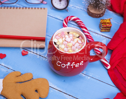 hot coffee with marshmallow in a red ceramic mug