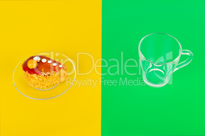 Chocolate cake on a bright yellow background and a transparent t