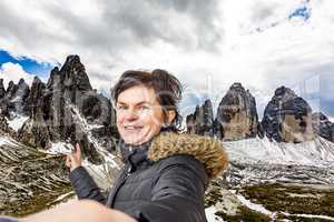 Woman points to the Three Peaks