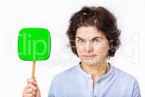 Woman holds up signboard