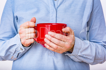 Woman is holding red cup