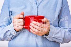 Woman is holding red cup