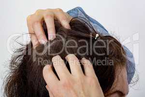 Woman controls head on hair loss