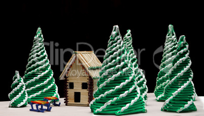 Toy spruces and a house
