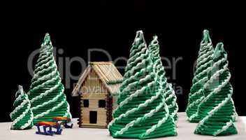 Toy spruces and a house