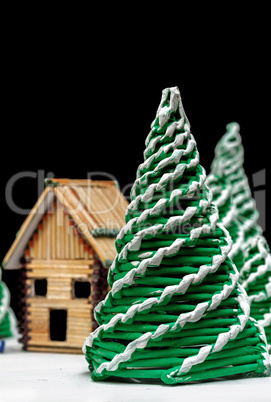 Toy spruces and a house