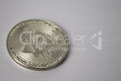 silver coin bitcoin on white background black and white style