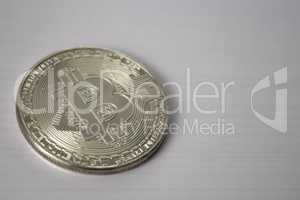 silver coin bitcoin on white background black and white style