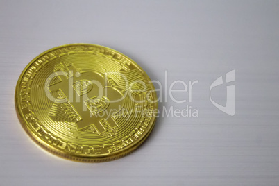 gold coin bitcoin on white background close-up