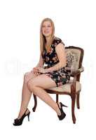 Lovely woman sitting in old armchair
