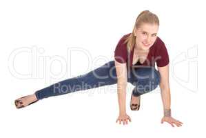 Slim young woman crouching on floor