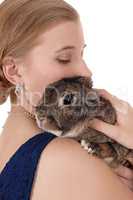 Young woman holding a rabbit on her shoulder