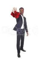 African man throwing his red tie away