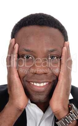 Happy African man with hands on face