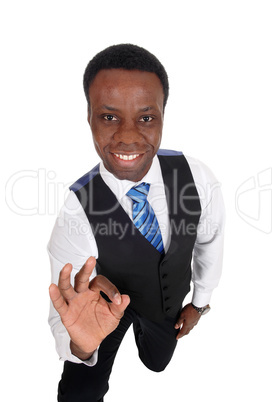 African man kneeling making OK sign