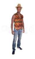 Tall African man standing in vest and jeans
