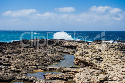 Rocky coastline and waves in Malta.
