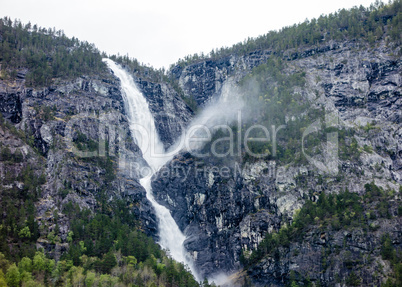 Waterfall on cliffs near Sognefjord, Norway.