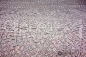 Old European square cobblestones in arcs.