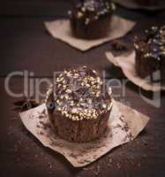 chocolate muffin sprinkled with nuts