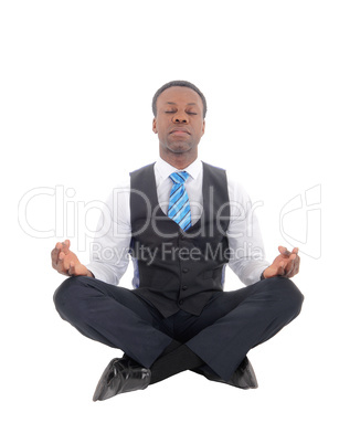 Handsome African man sitting doing yoga