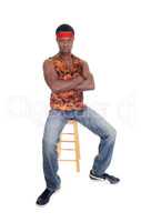 Handsome African man sitting in a vest
